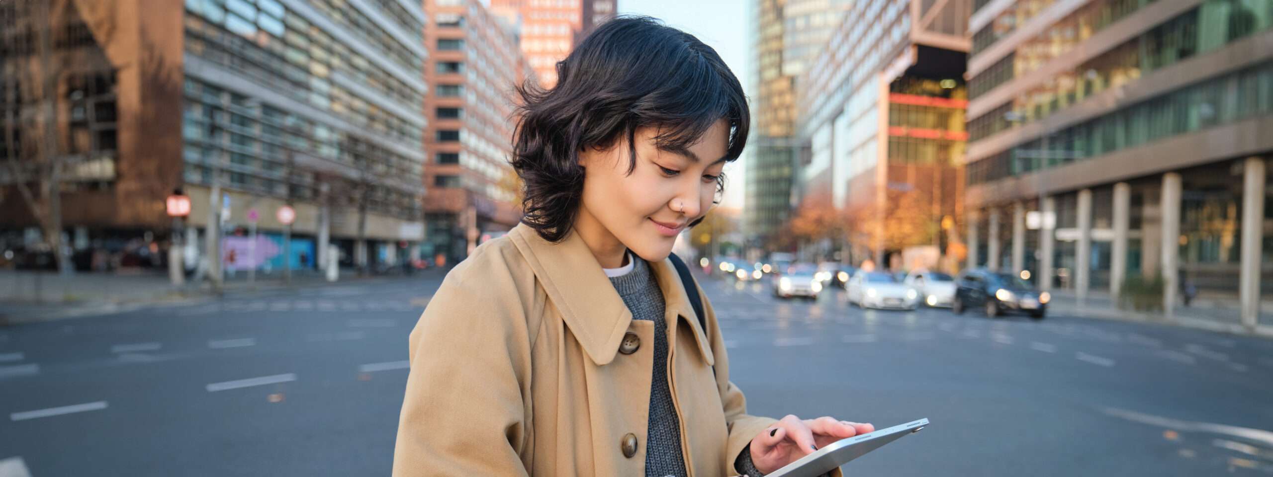 portrait young korean student girl walks city with digital tablet stands street uses her scaled