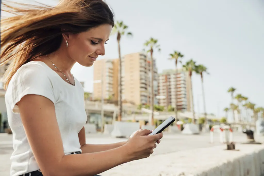 sideways woman looking her phone